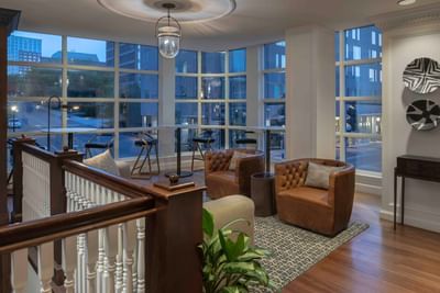 Lounge area with city view through the large windows at Portland Harbor Hotel