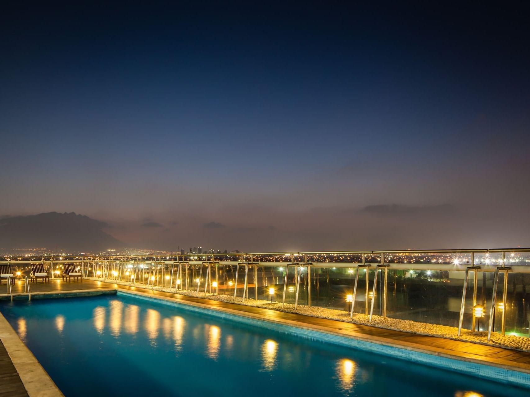 Night view of the Rooftop pool area at Fiesta Inn Hotels