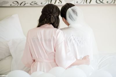 Back view of bride with the bridesmaid posing at Southern Palms