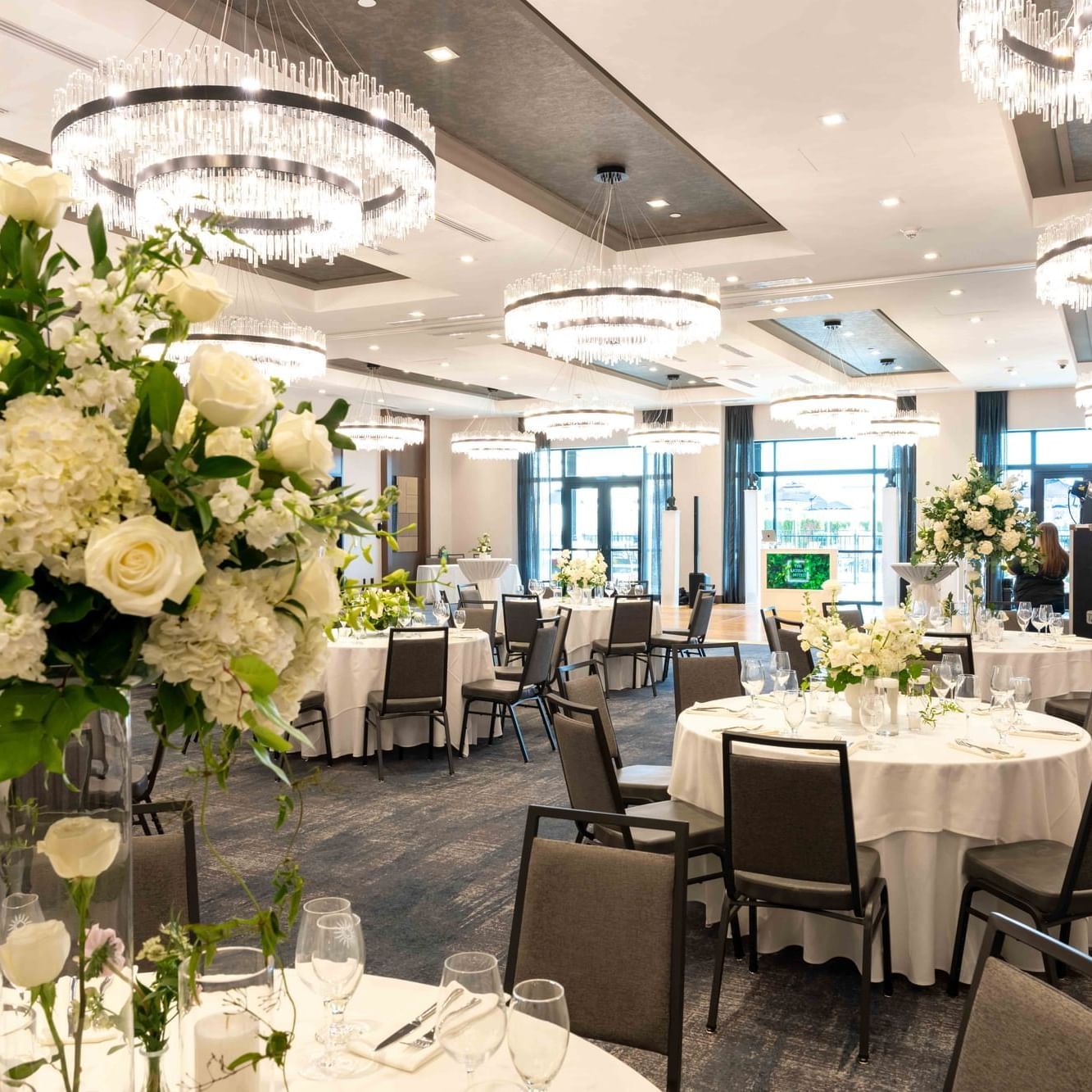 Dining tables arranged in The Ballroom at The Artisan Hotel at Tuscan Village