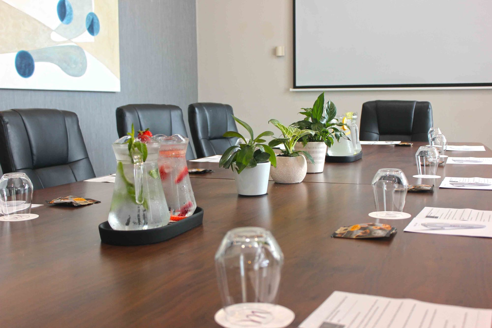 Boardroom 1 with a table featuring mini plants at Mercure Kooindah Waters