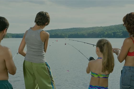 Children holding fishing ropes, The Lodge at Schroon Lake