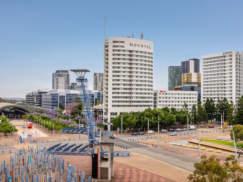 Panoramic city view with modern buildings and the Pullman Sydney Olympic Park hotel at Sydney Olympic Park.