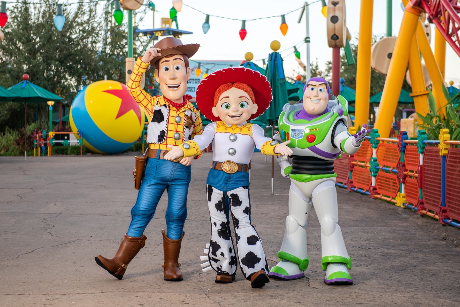 Costumed characters from Toy Story posing in Disney's Hollywood Studios near Lake Buena Vista Resort Village & Spa