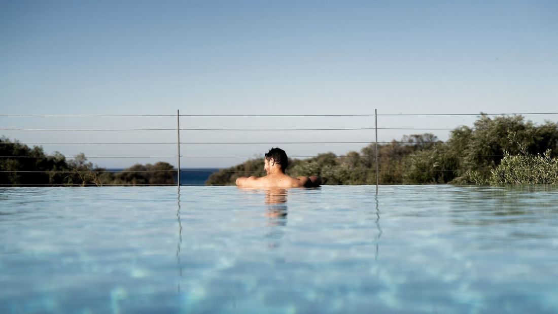 Relax poolside at Pullman Bunker Bay Resort