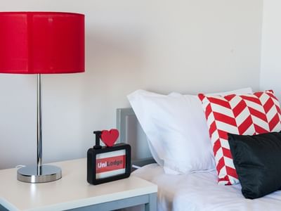Typical studio single apartment - bed & bedside table