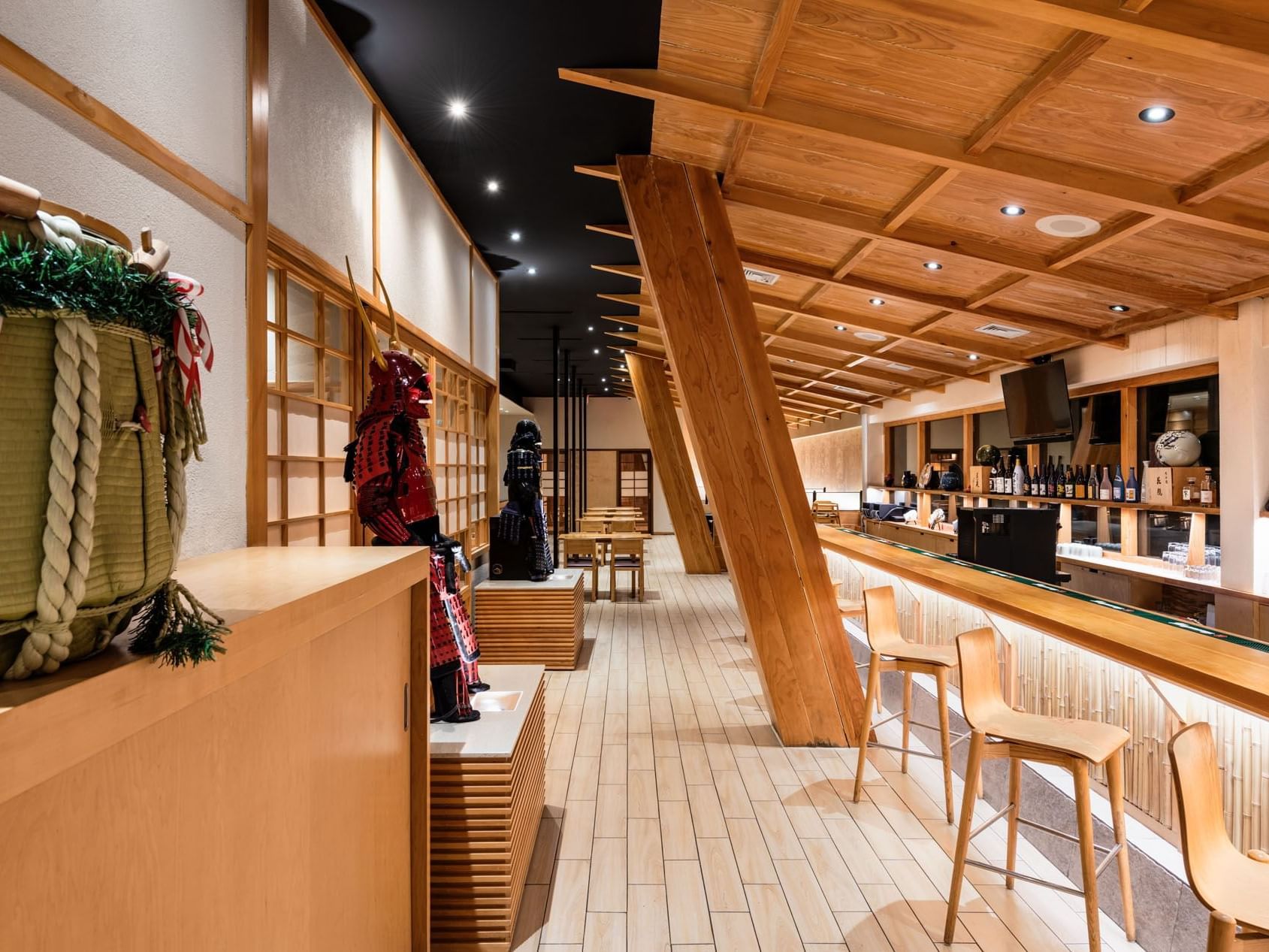 Aoi Japanese Restaurant interior with wooden furniture and bar counter at APA Hotel Woodbridge