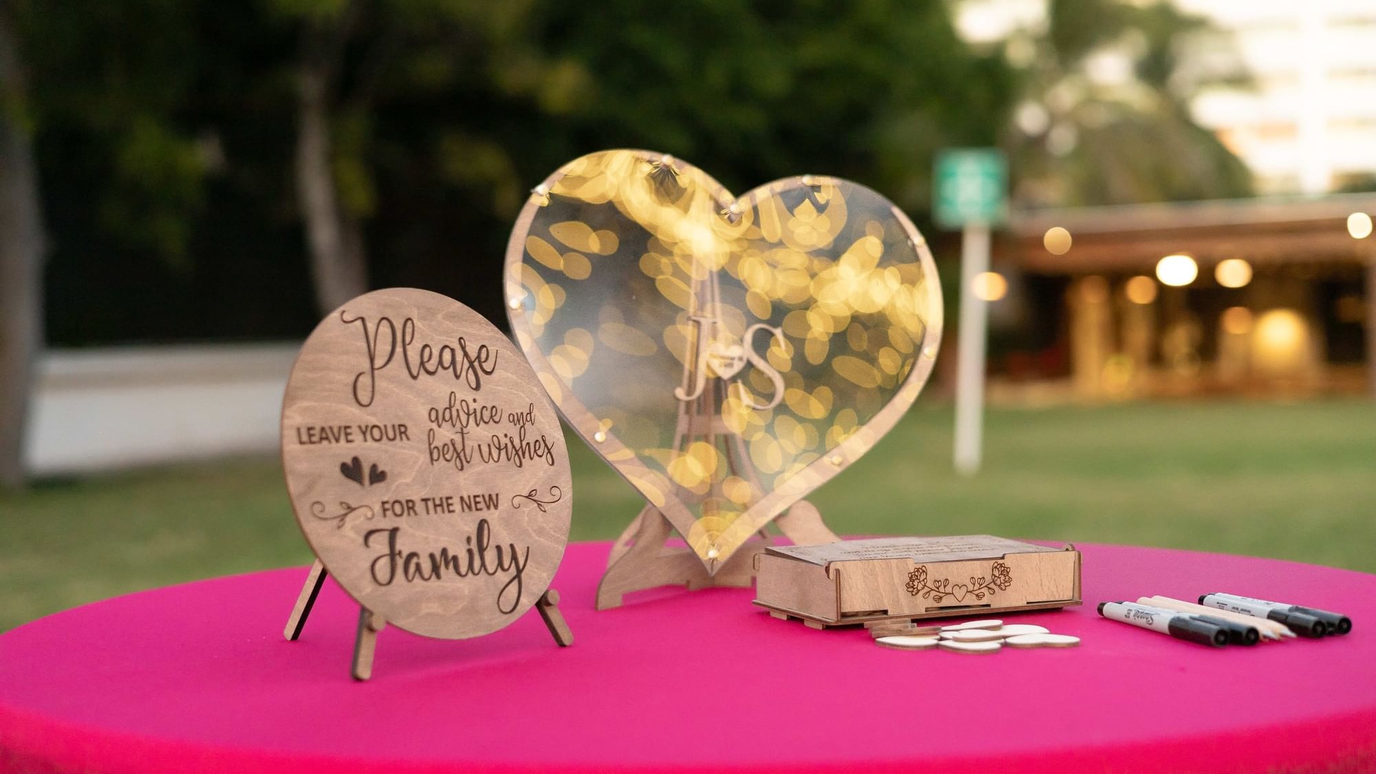 A pink table with heart-shaped signs and markers at Riviera Nayarit Resort & Spa.