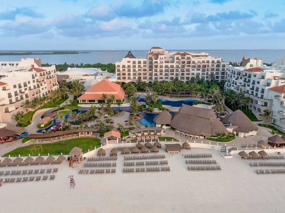 Aerial view of hotel complex, pool area & beach with sun loungers at Fiesta Americana Condesa Cancun