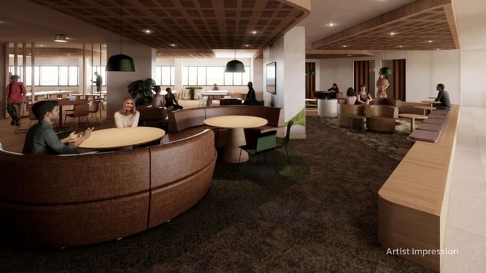 A modern resident lounge at UniLodge Brisbane City in Brisbane City with seating areas and people.