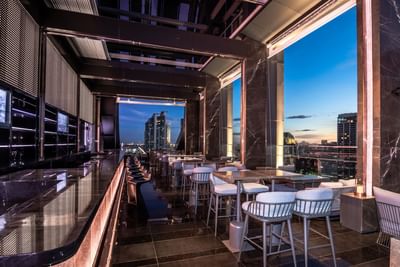 Seating area in rooftop bar at Carlton Hotel Bangkok Sukhumvit