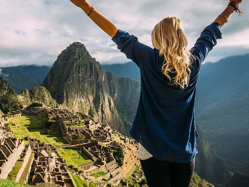 A girl on top of Machu Picchu Mountain at Hotel Sumaq