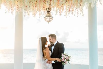 Bride & groom posing in a gazebo, The Morgan Resort Spa Village