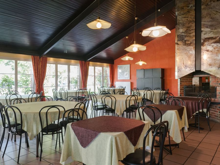 Interior of arranged dining area at La berteliere rouen