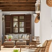 An outdoor lounge area in El Cortijo at Marbella Club