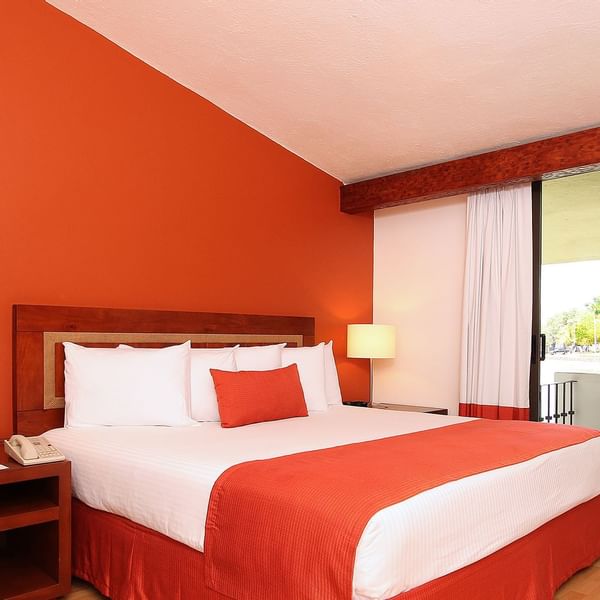 King bed in Superior Room at Fiesta Inn
