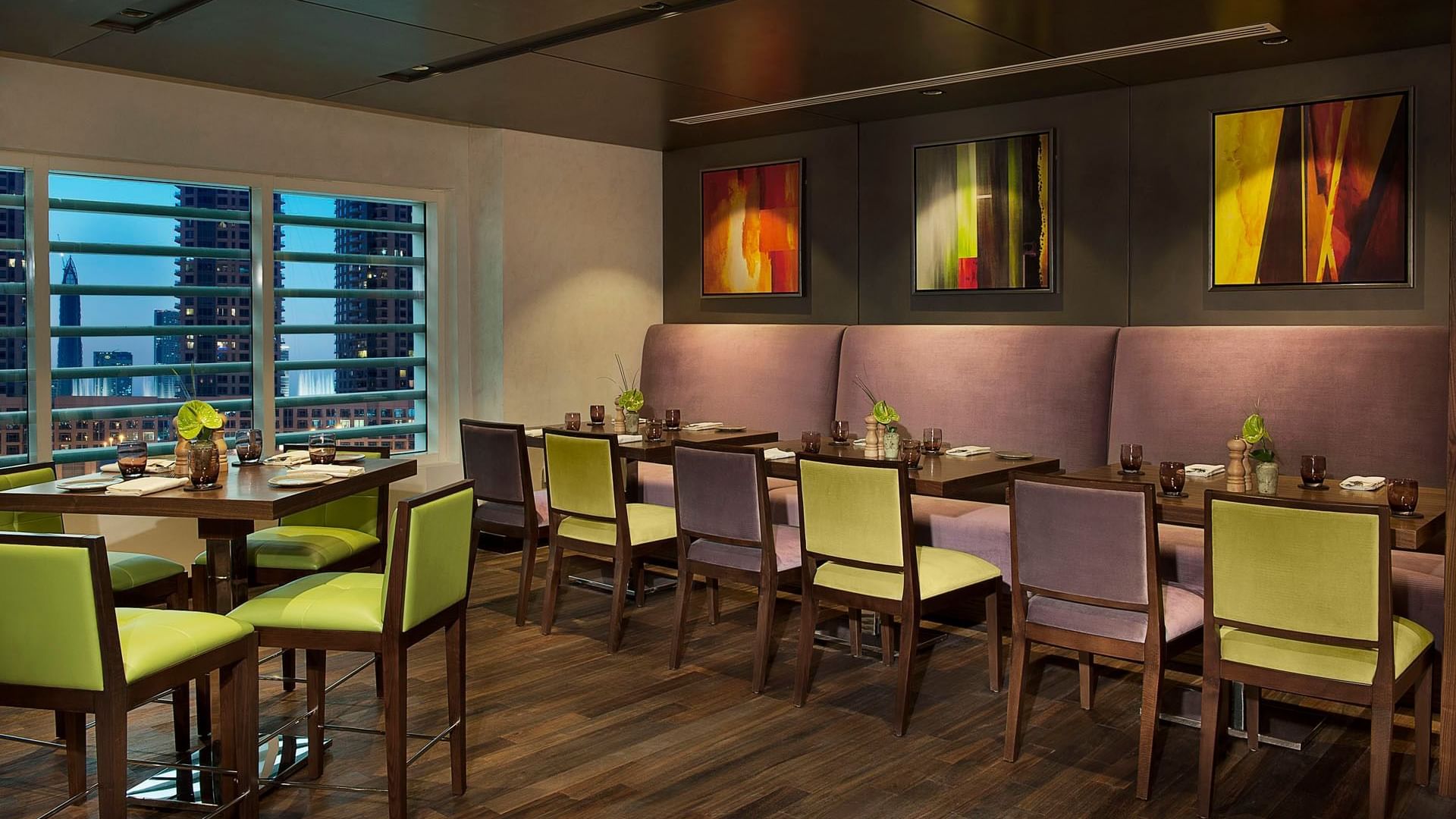 Neatly arranged dining area in La Maison Restaurant at DAMAC Maison Canal Views