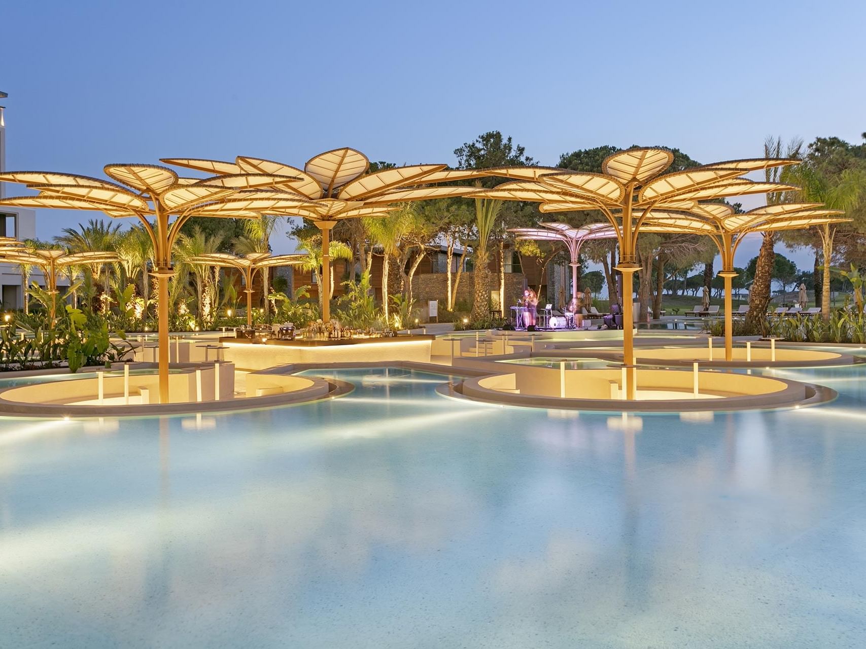 Azure Pool Bar with artistic umbrellas, surrounded by tropical plants at Cullinan Belek