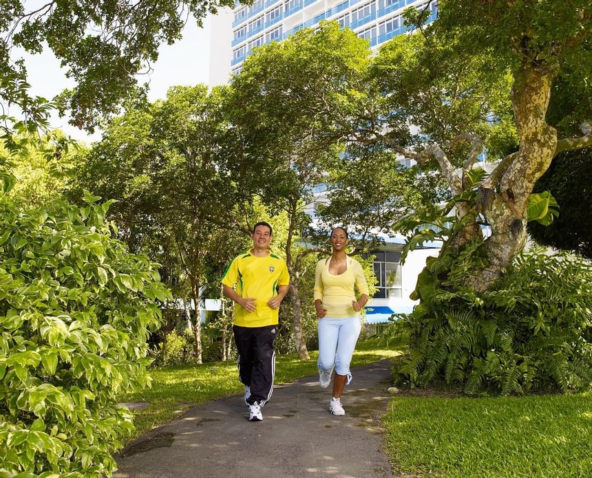 A man and a woman jogging at Jamaica Pegasus Hotel