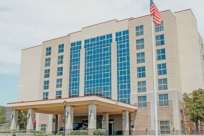 The well manicured exterior of Hotel Topeka at City Center.