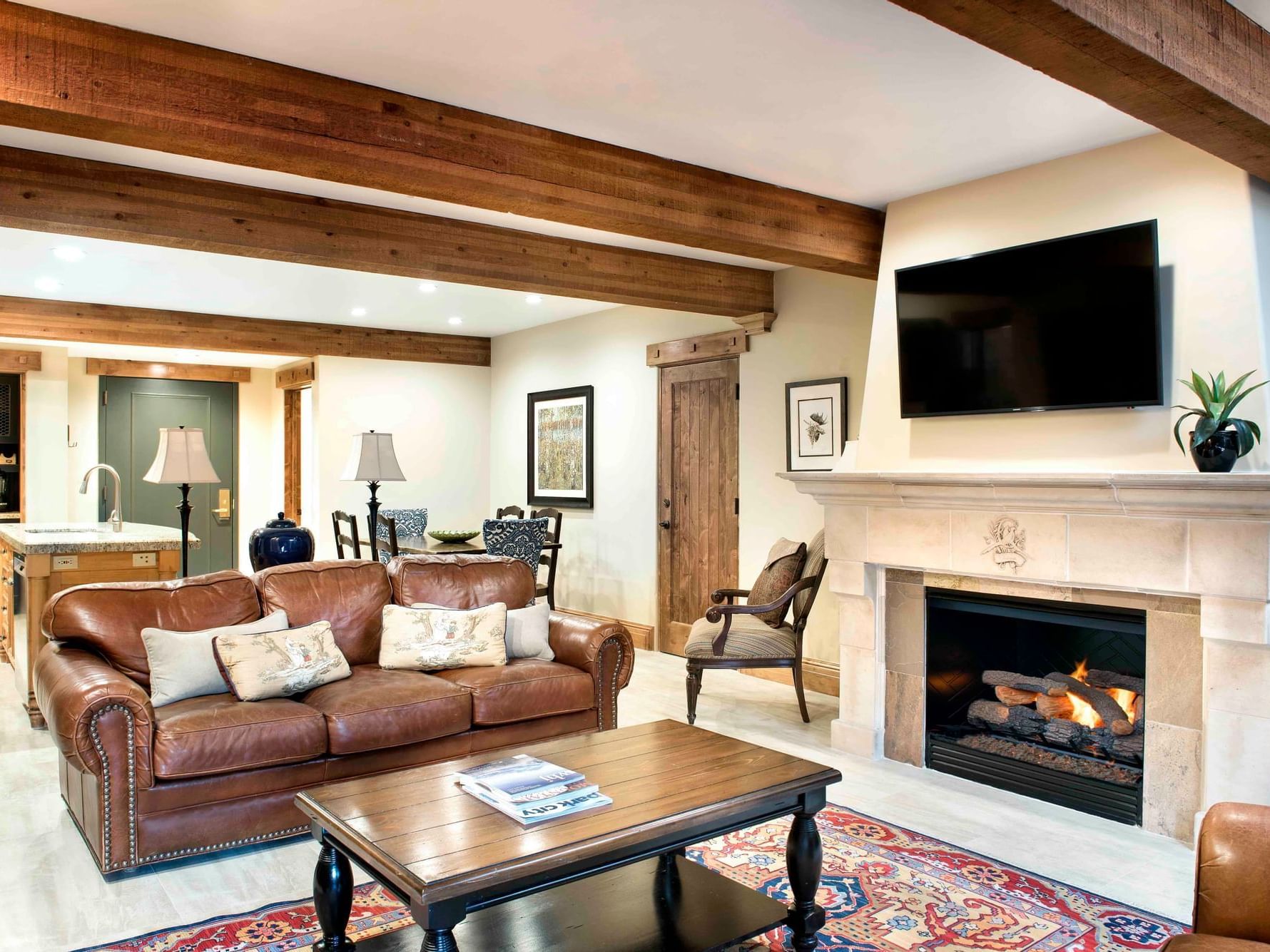 Living area with seating and fireplace in Studio With Murphy Bed at Chateaux Deer Valley