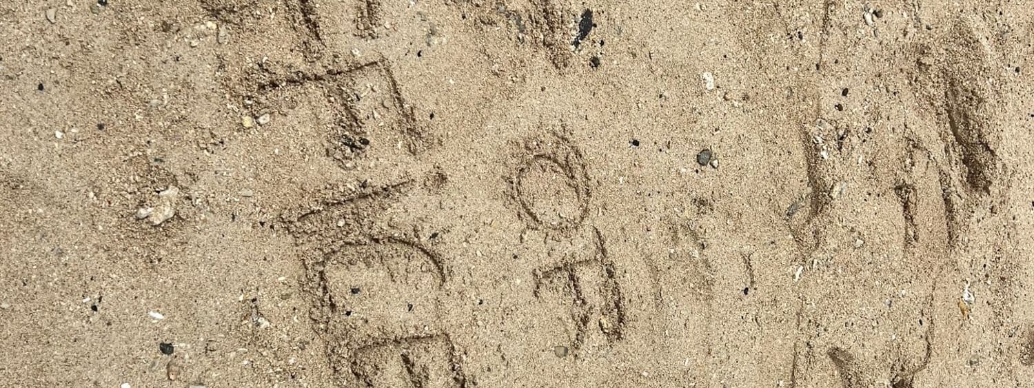 Beach office written in the sand at Warwick Fiji Resort and Spa in Korolevu
