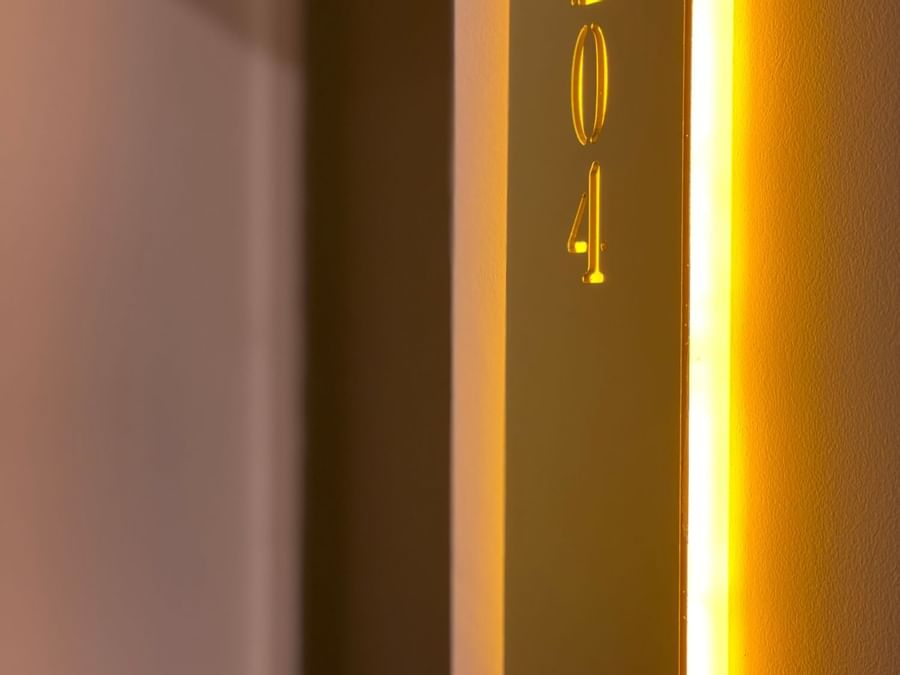 Close-up of a room number plate at The Originals Hotels