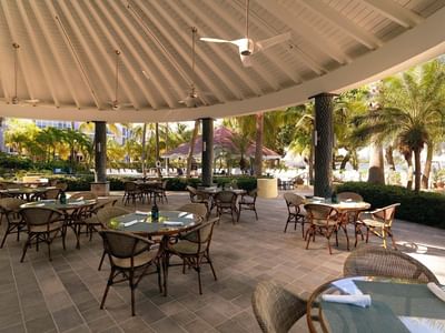 Outdoor dinning area at Main pool restaurant at Condado Plaza