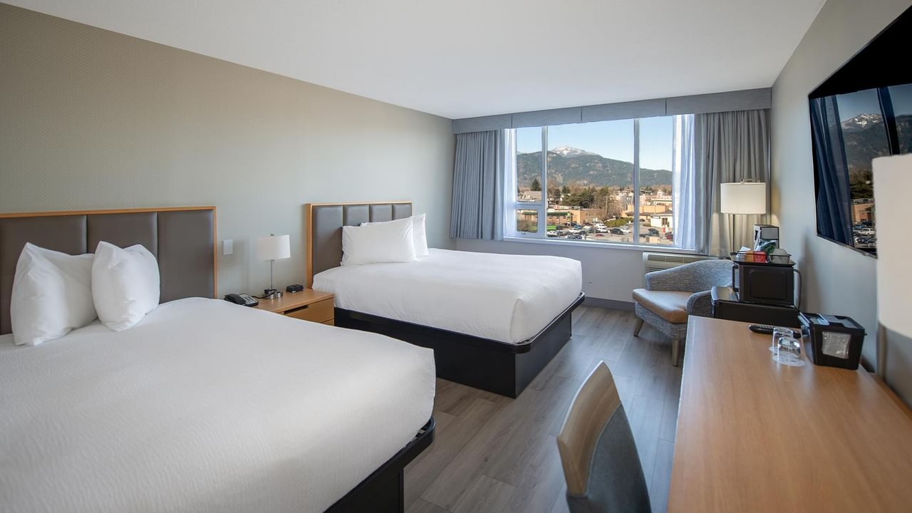 Two queen beds hotel room at Coast Chilliwack Hotel by APA.