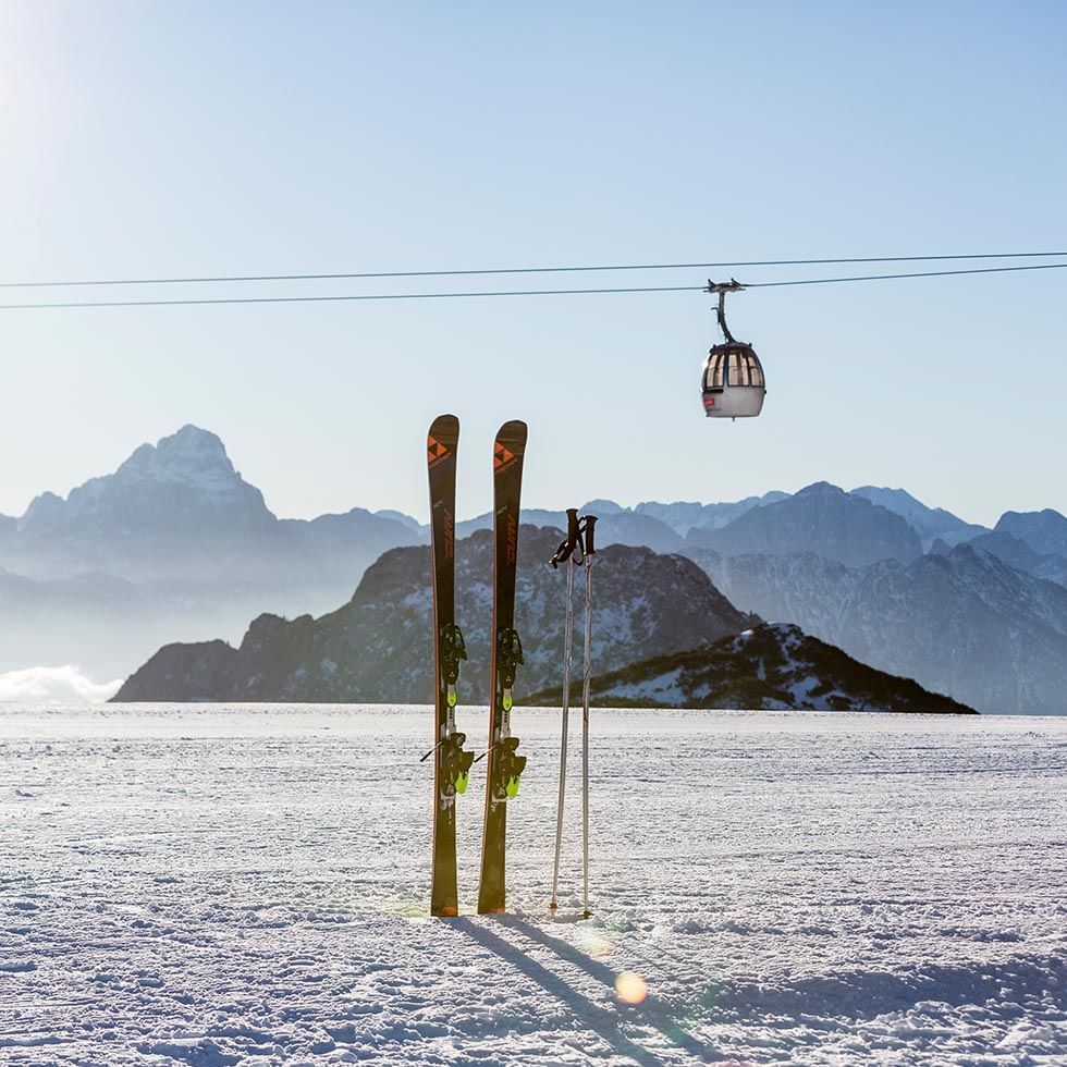 Mountains and ski equipment on snow near Falkensteiner Hotels