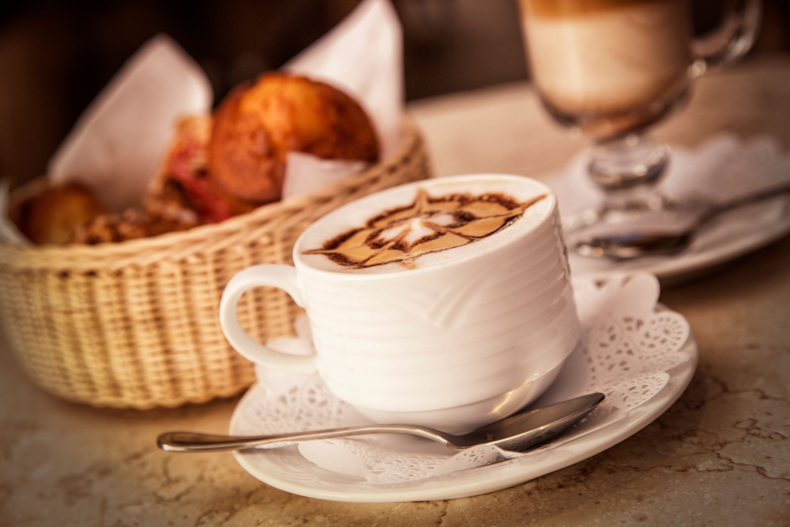 Close up of hot latte with muffins served at Marquis Los Cabos