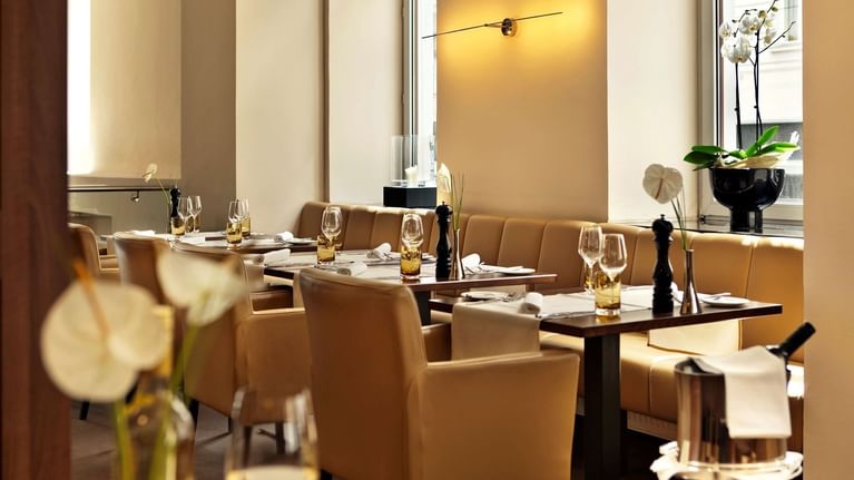 Dining table setup in restaurant at Flemings Selection Hotel