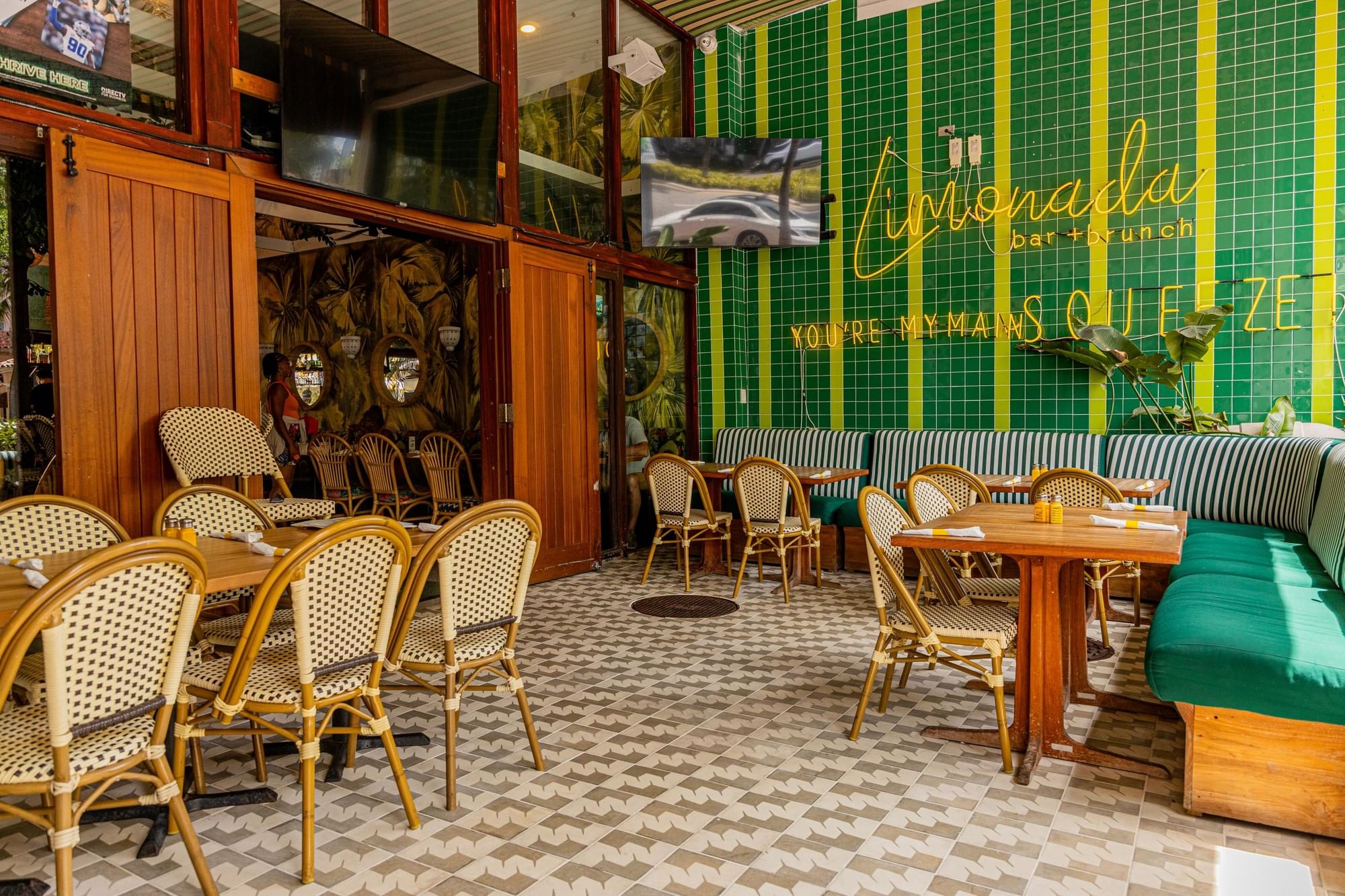 a dining area with tables and chairs