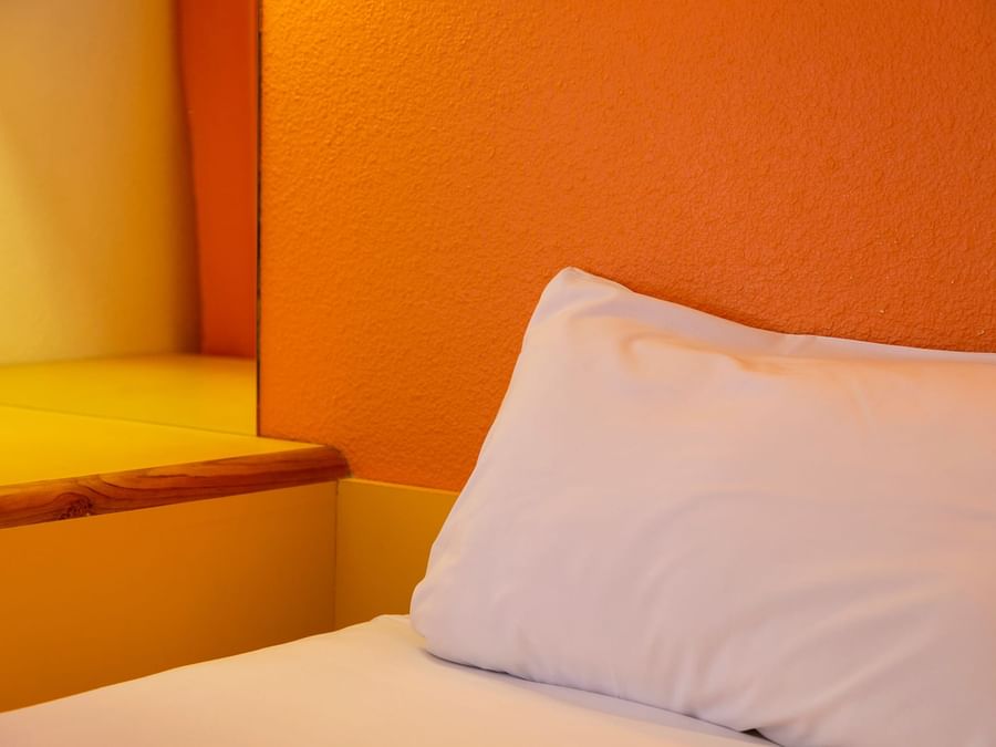 Closeup of a Bedroom with pillows at Hotel Bordeaux Lake