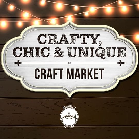 Crafty, Chic & Unique Craft Market Event Logo against a wood background with hanging lights