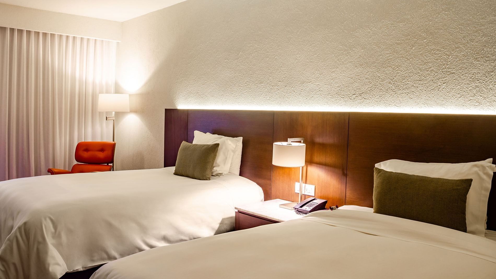 2 Double Superior Deluxe Garden View featuring a dark wood headboard and warm ambient lighting at Camino Real Polanco Mexico