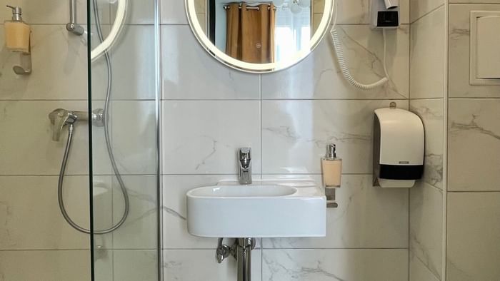 Bathroom interior in Hotel Le Marignan at The Originals Hotels