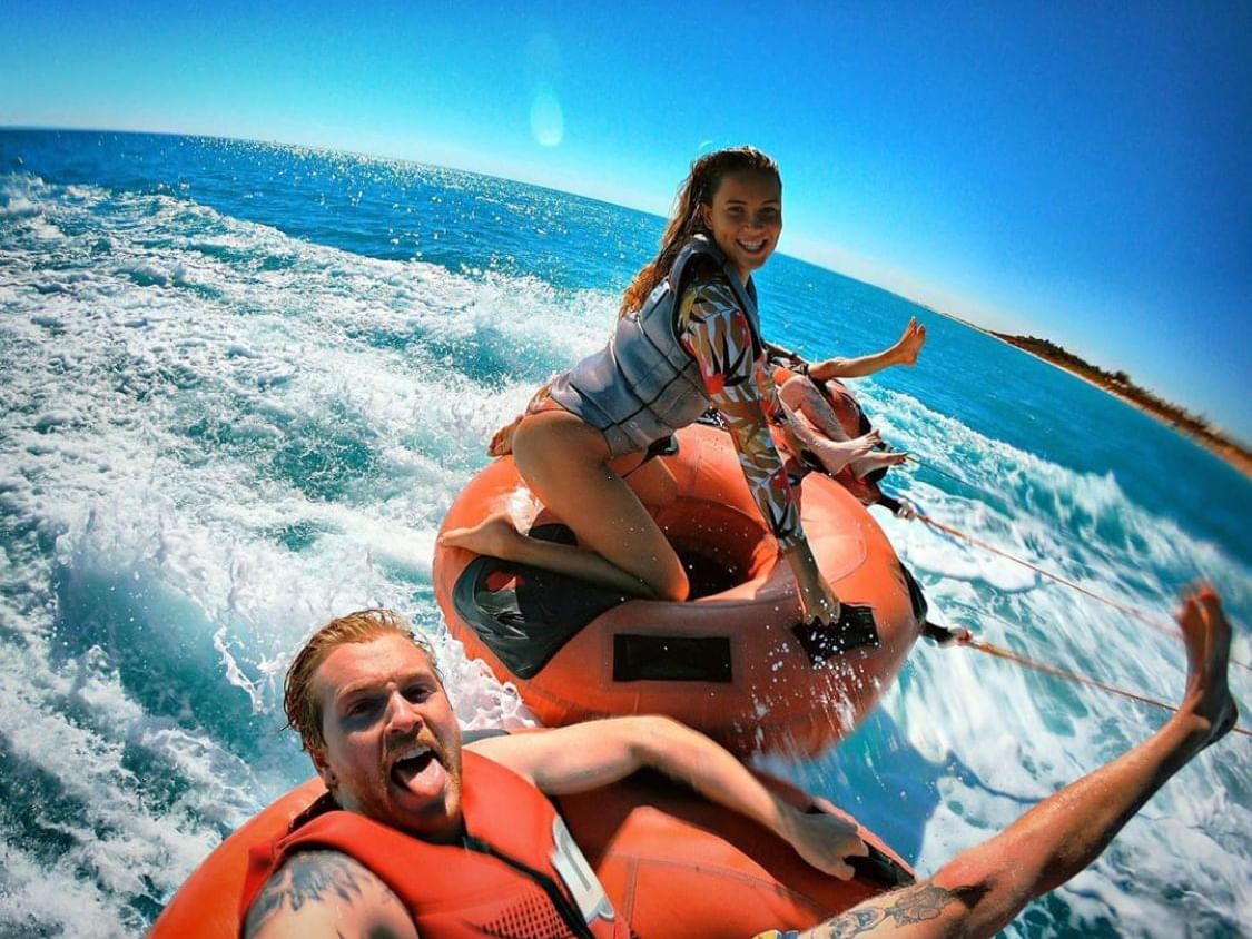 Couple enjoying watersports near Ocean Centre Hotel