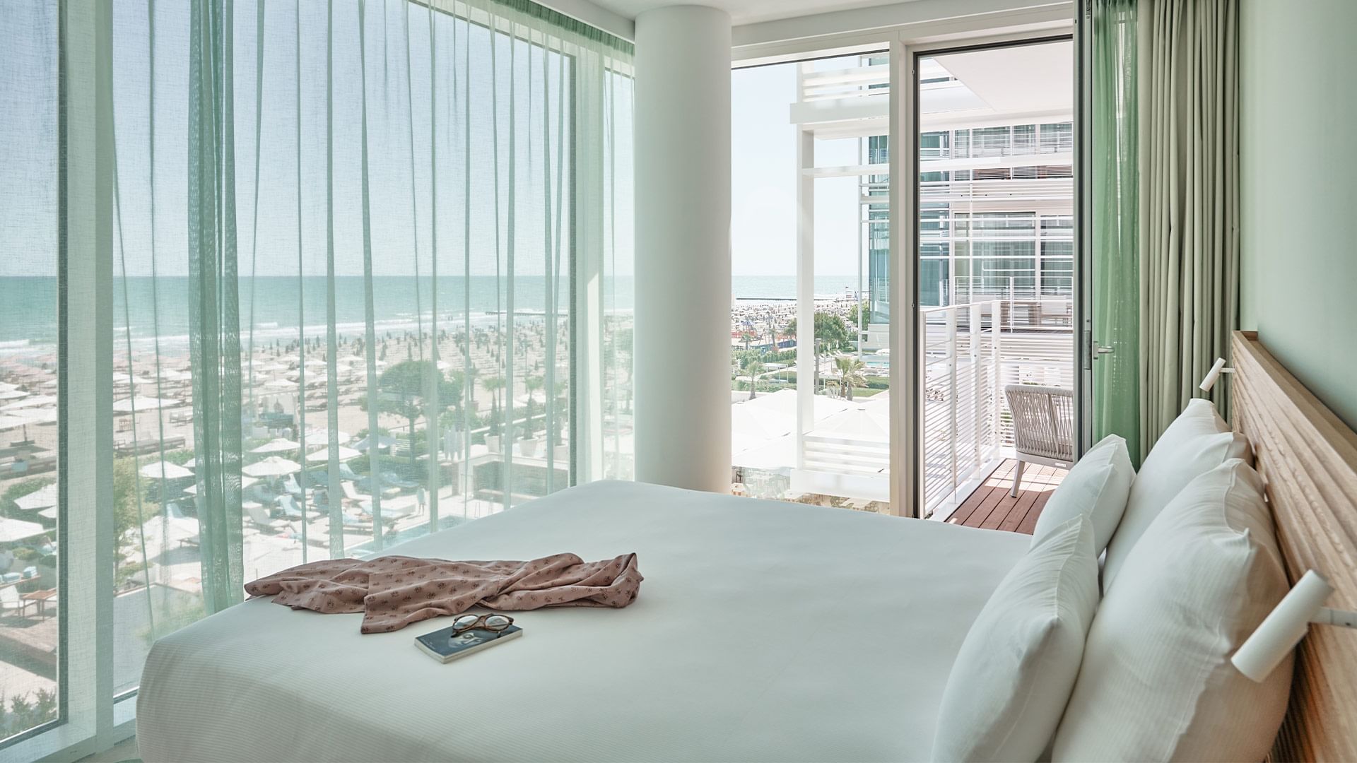 Comfy bed in Apartment Bateo facing the sea view at Falkensteiner Residences Jesolo