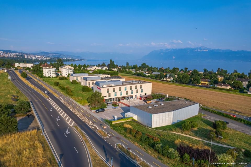 Distant view of the Starling Hotel Lausanne & city on a sunny day