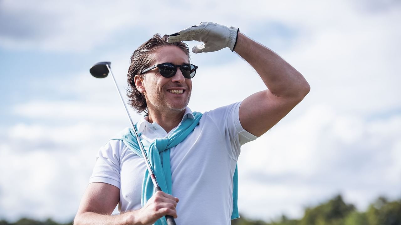 A man holding a golf club