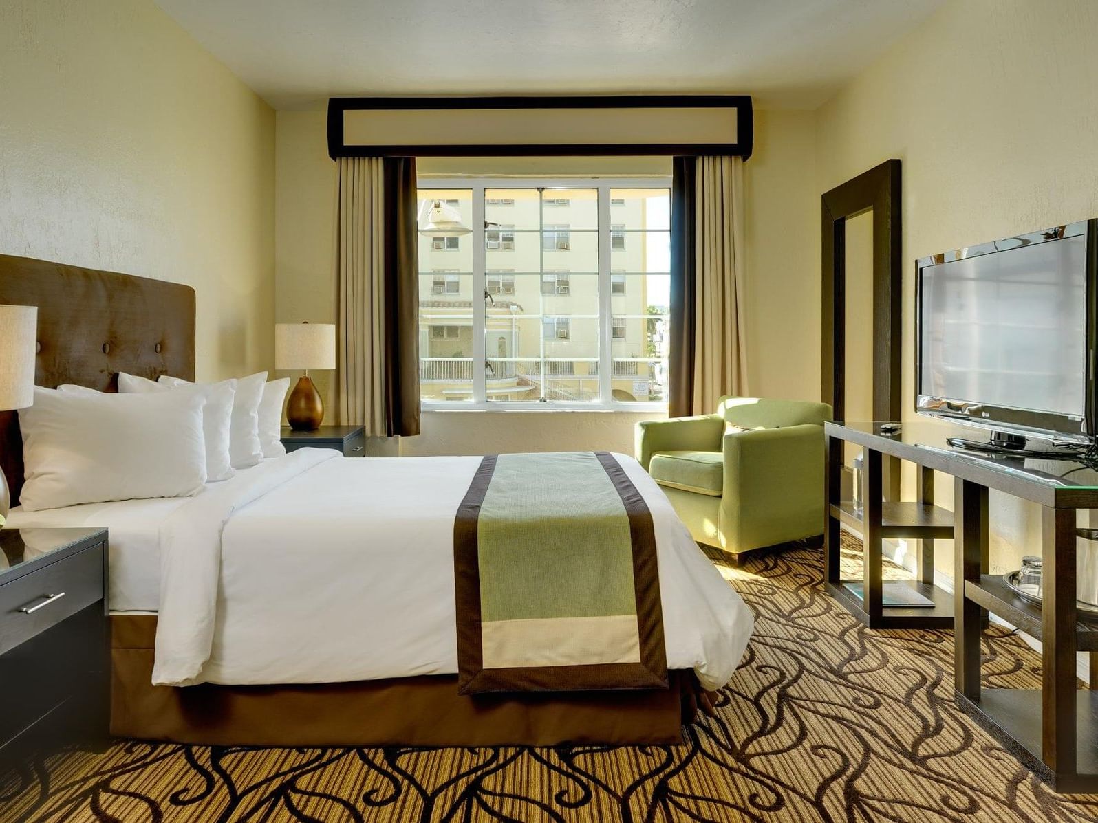 A view of Deluxe Queen room with one king bed at Essex House by Clevelander