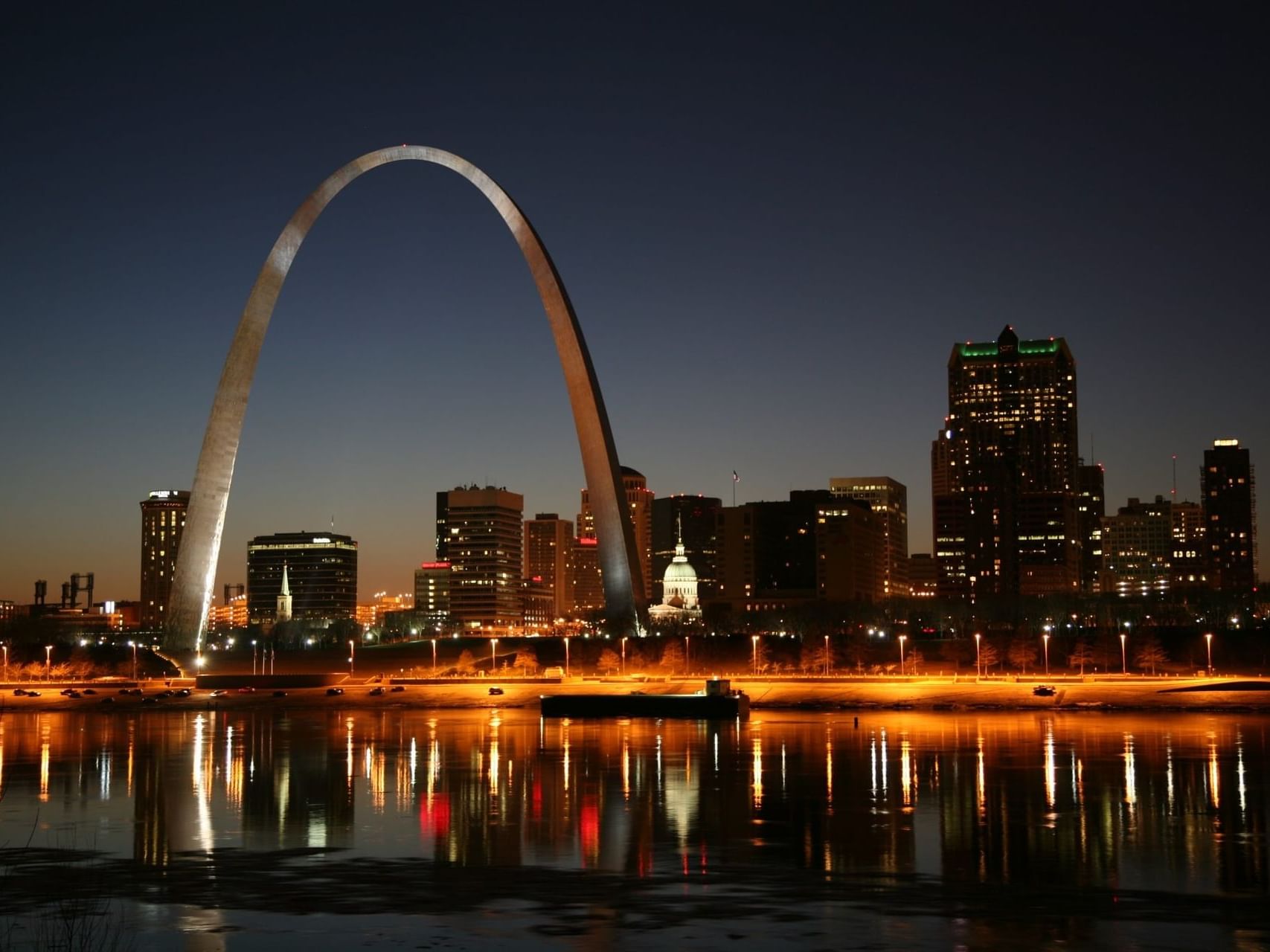 Distant view of The Gateway Arch near St. Louis Airport Hotel at night