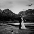 Newly wedded couple by the mountains near Freycinet Lodge