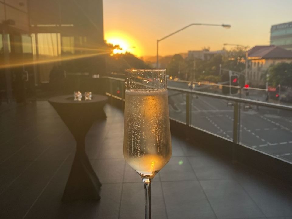Champagne glass on a terrace at Grand Chancellor Brisbane