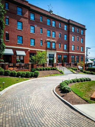 Exterior view of entrance with the path at Hotel Weyanoke