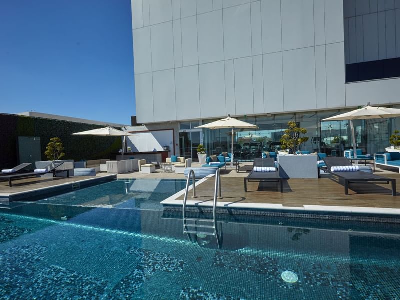 Outdoor swimming pool with pool beds at Grand Fiesta Americana