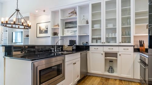Kitchenette with cabinets & appliances in Premium Resort suite at Watersound Inn