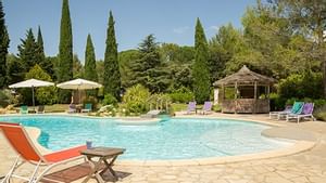 Sunbeds by outdoor pool at La Villa Vicha
