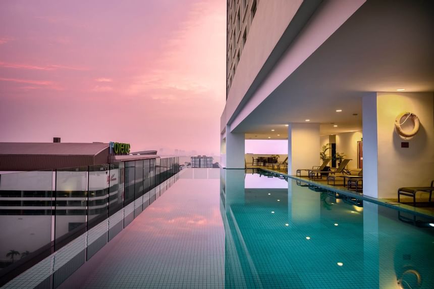 Infinity swimming pool on a balcony at St. Giles Wembley Hotel 